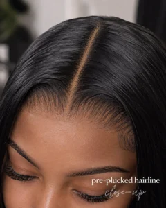 Close-up of a pre-plucked hairline with a sleek middle part